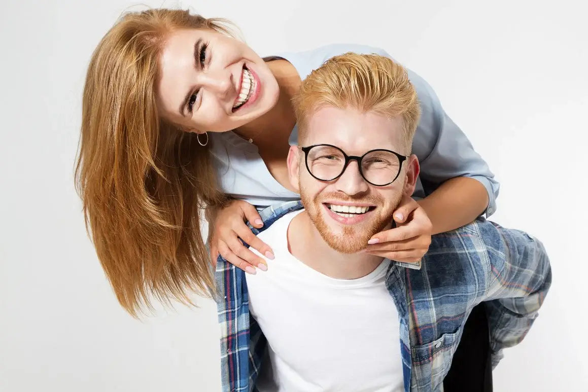 Smiling couple playing and laughing together.