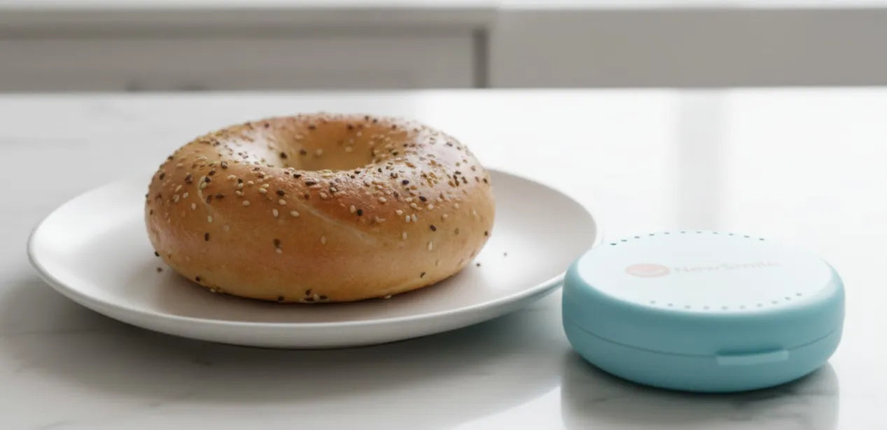 Bagel breakfast with NewSmile aligner case nearby