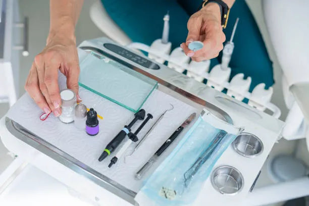 Composite bonding materials and dental tools on a tray