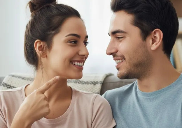Couple enjoying a kiss with clear aligners, showcasing confidence and hygiene.