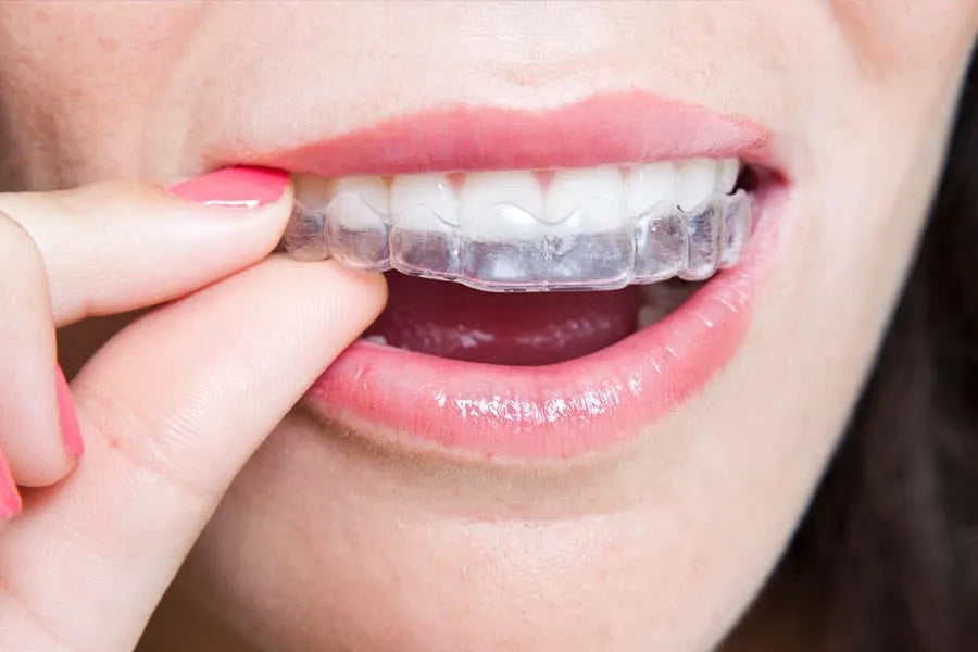 Sleeping with a custom-fit retainer to protect aligned teeth