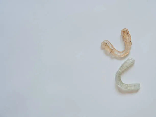 Nicotine stains on clear retainers caused by smoking