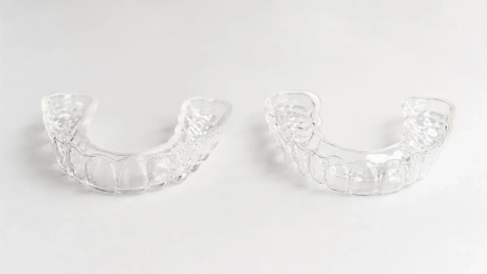 custom clear retainer Canada comparison - Cheeky vs NewSmile custom Essix retainer