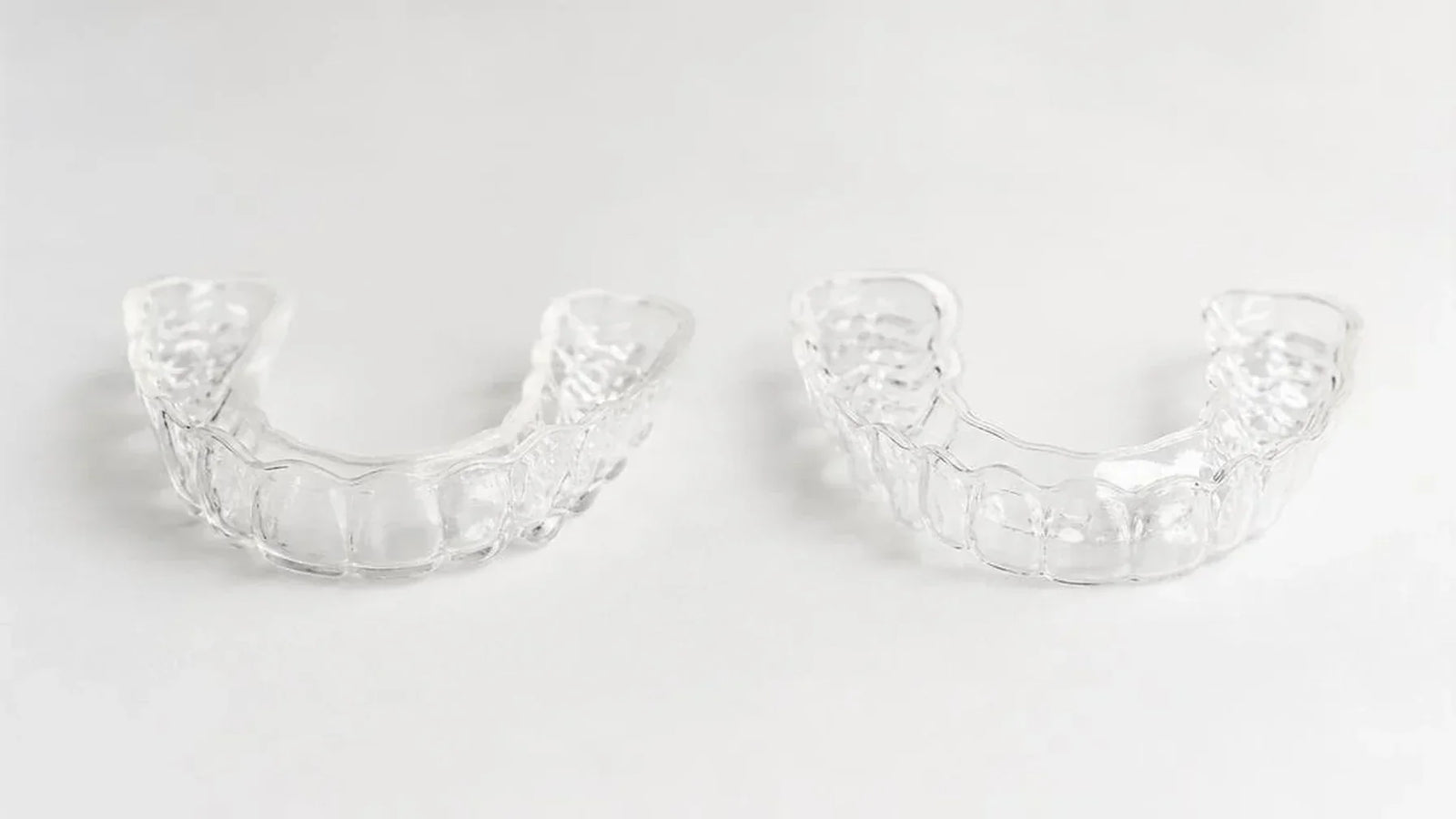 custom clear retainer Canada comparison - Cheeky vs NewSmile custom Essix retainer