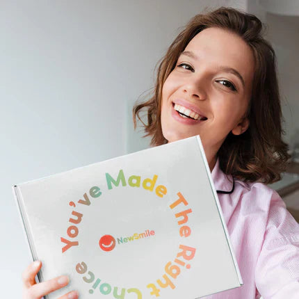 Women holding the NewSmile package box