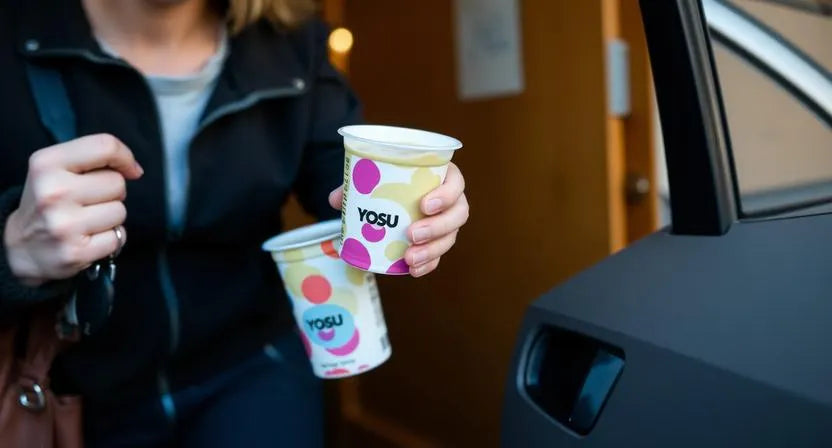 Busy person taking a quick soft breakfast before leaving home.